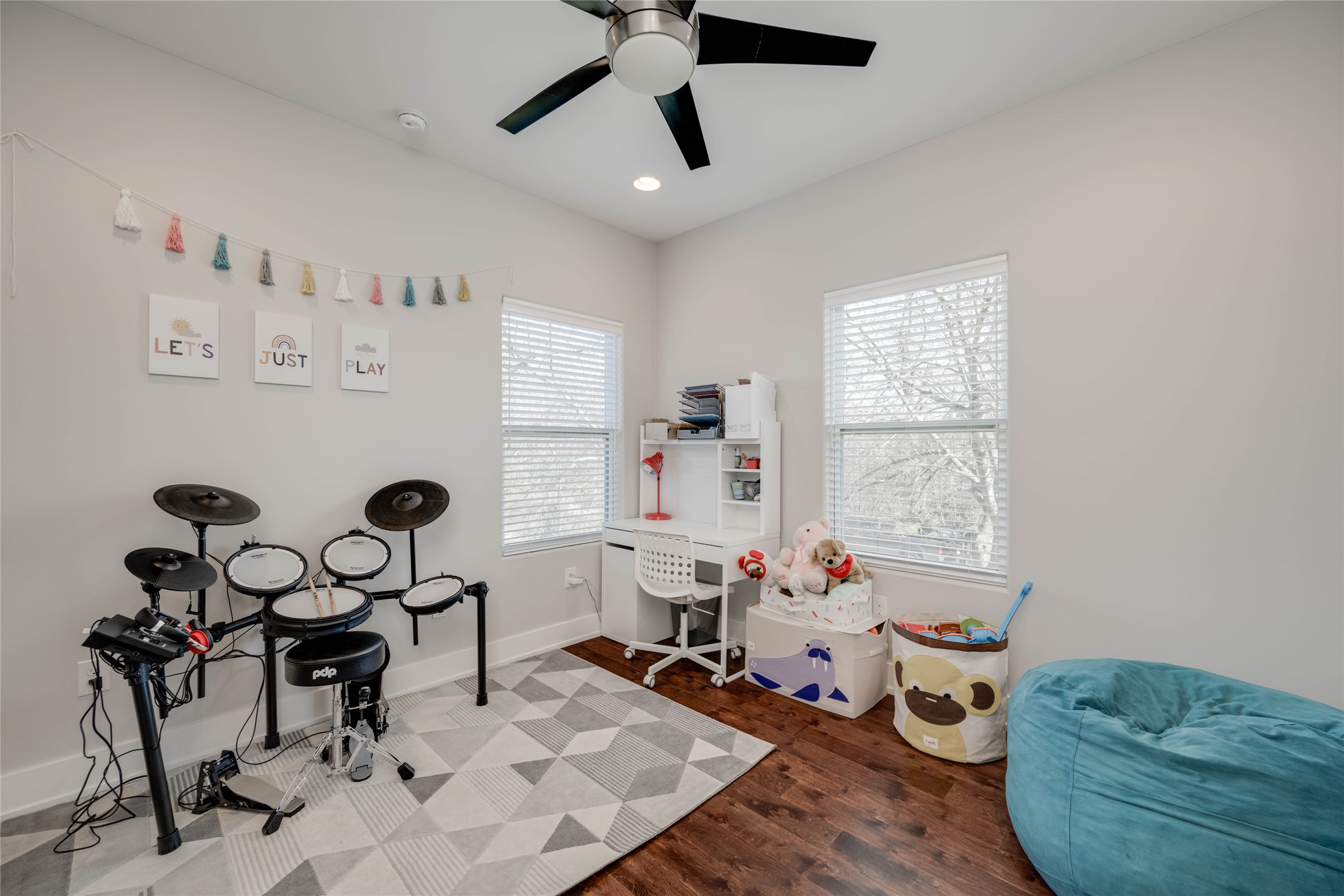 7514 Hardy Drive Austin, TX 78757 - Photo 11 of 29 Playroom with dark wood-style floors, a ceiling fan, and recessed lighting