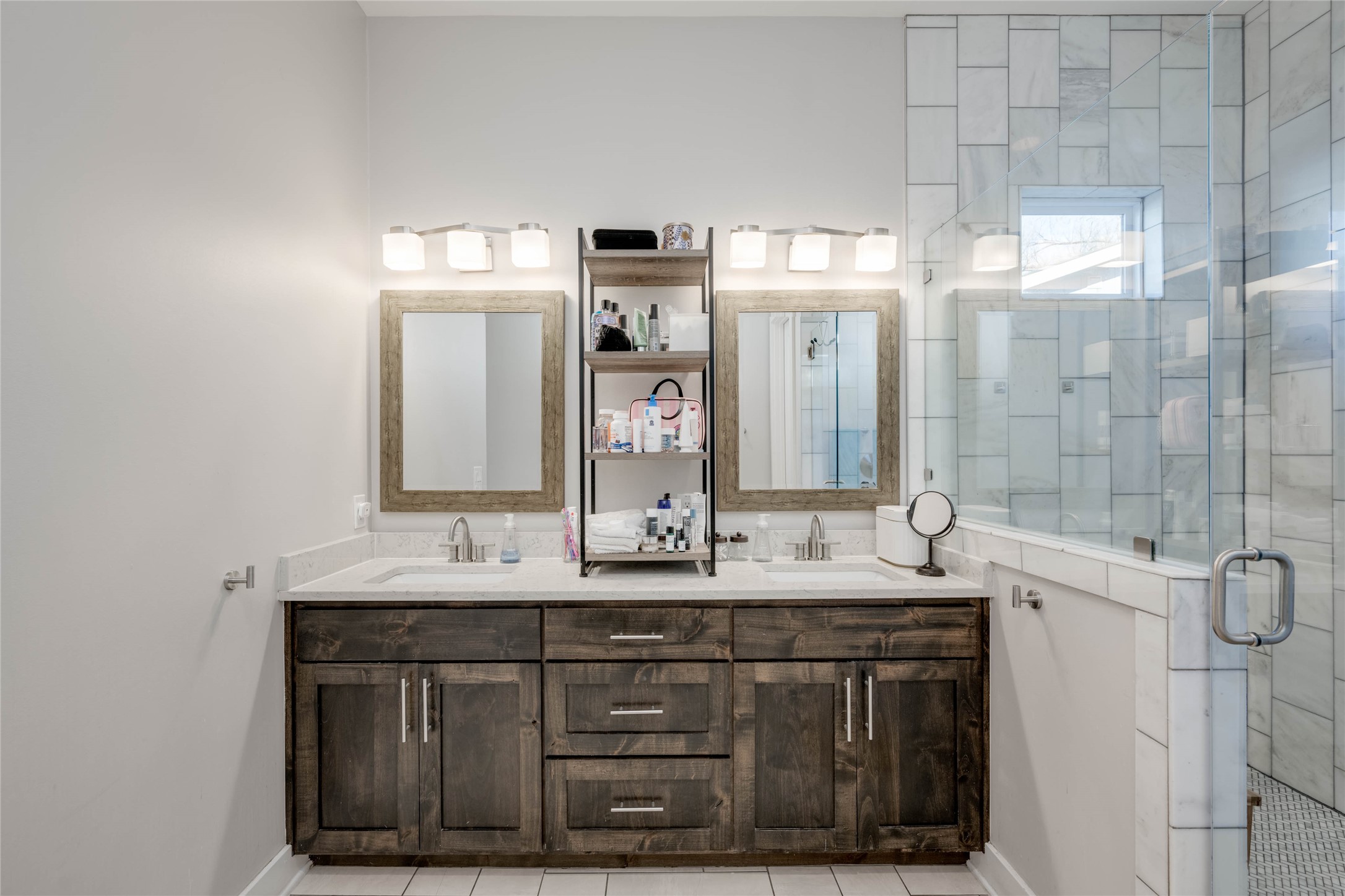 7514 Hardy Drive Austin, TX 78757 - Photo 19 of 29 Full bath with a shower stall, double vanity, and light tile patterned floors