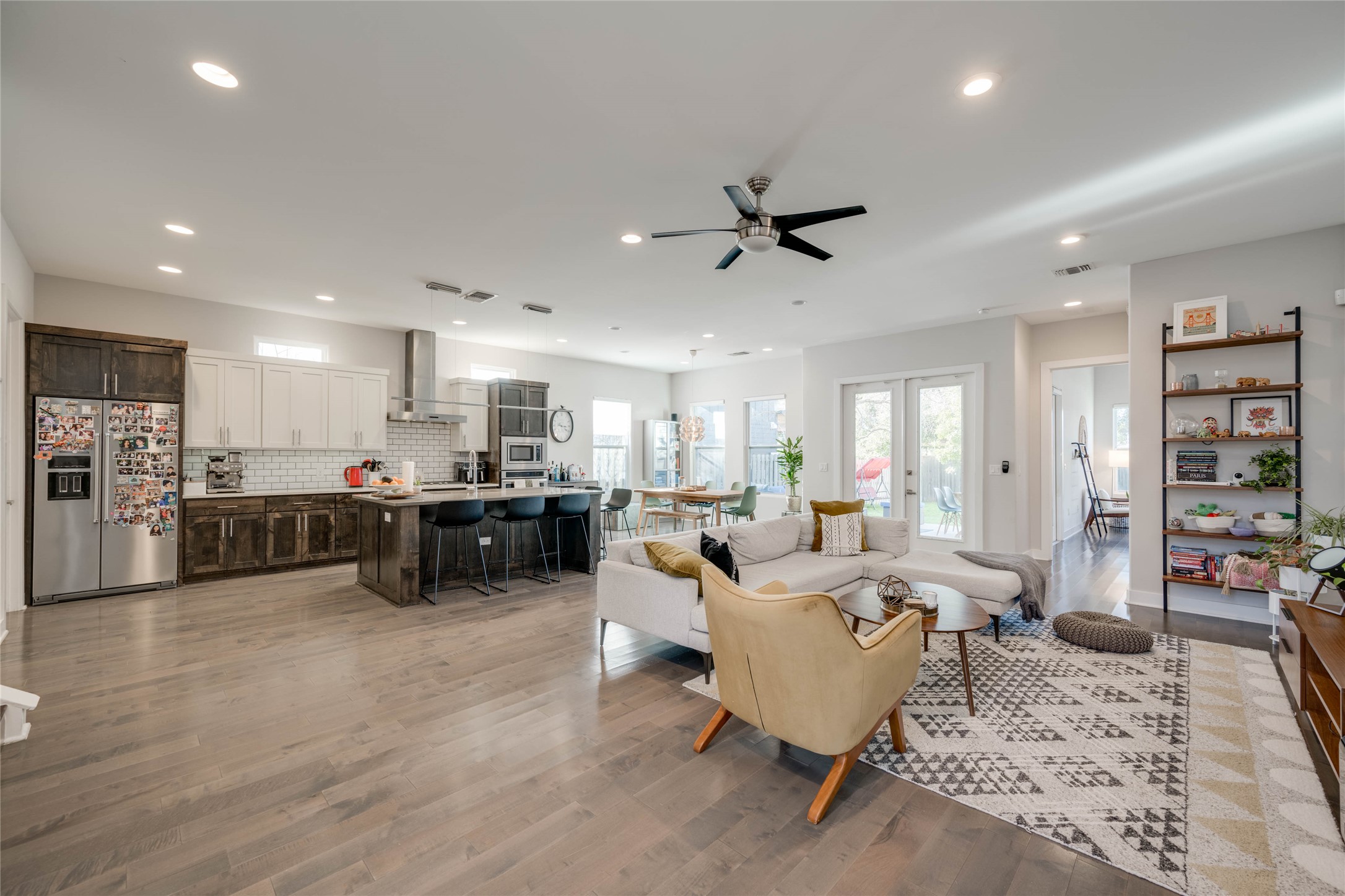 7514 Hardy Drive Austin, TX 78757 - Photo 2 of 29 Living room featuring french doors, light wood-style floors, a ceiling fan, and recessed lighting