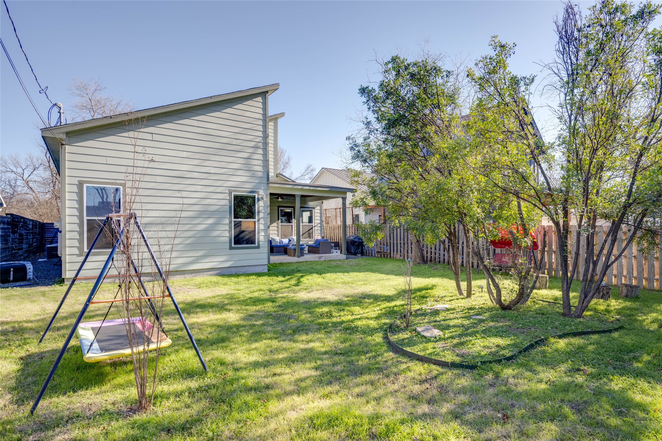 7514 Hardy Drive Austin, TX 78757 - Photo 26 of 29 Fenced backyard with a patio and outdoor lounge area