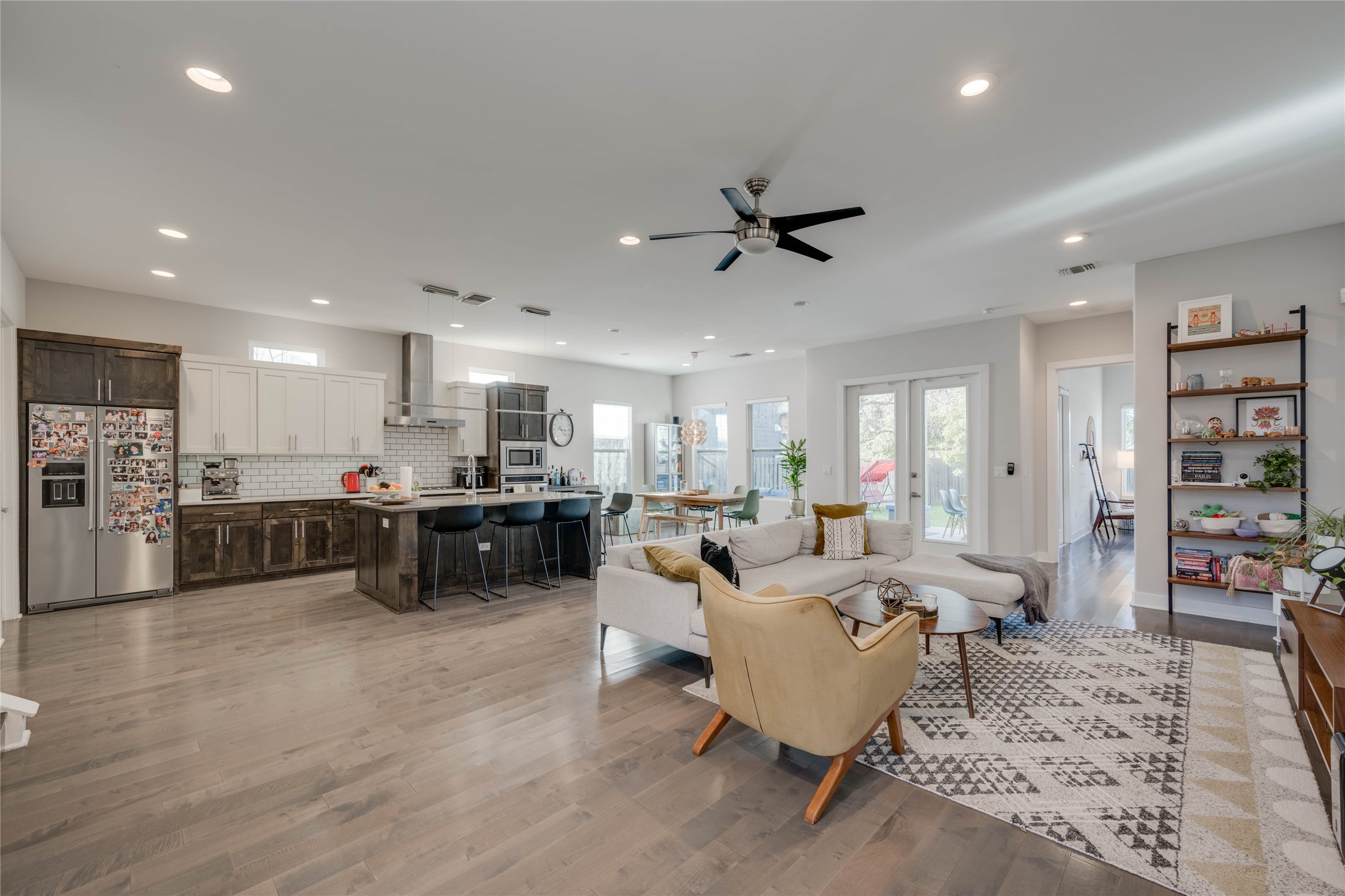 7514 Hardy Drive Austin, TX 78757 - Photo 3 of 29 Living room with light wood finished floors, french doors, a ceiling fan, and recessed lighting