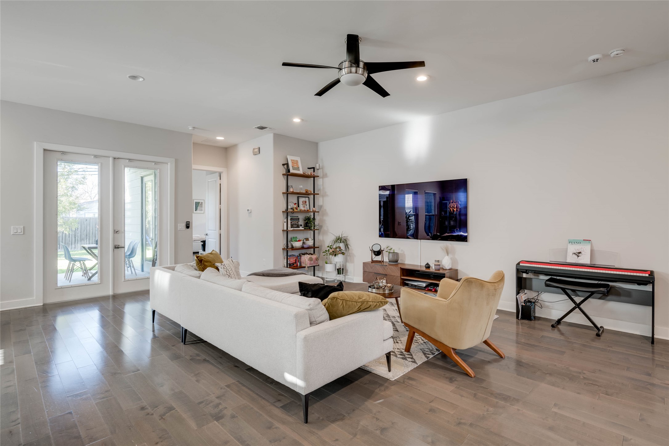 7514 Hardy Drive Austin, TX 78757 - Photo 5 of 29 Living room featuring light wood finished floors, french doors, a ceiling fan, and recessed lighting