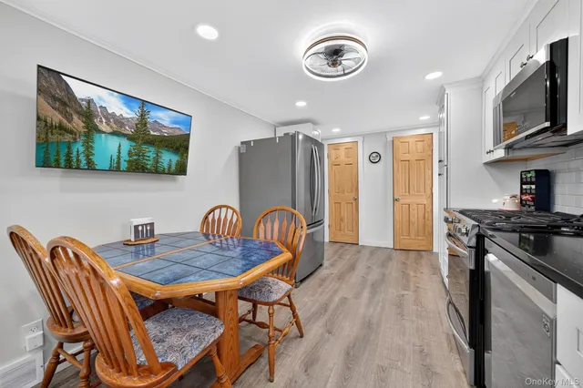 a dining room with furniture and window