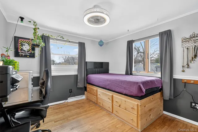 a spacious bedroom with a bed and a window