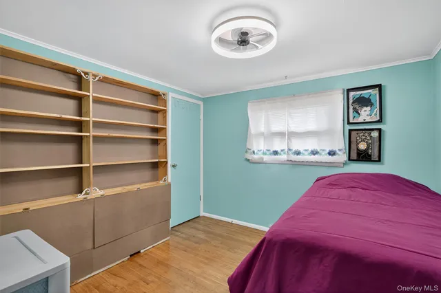 a bedroom with a bed and a cabinets