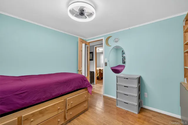 a room with furniture and a large mirror