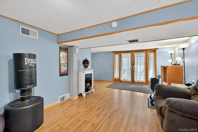 a bedroom with furniture and a window