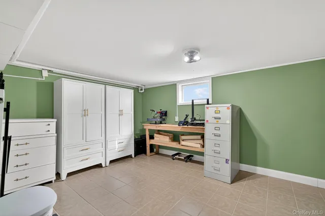 a view of room with furniture and windows