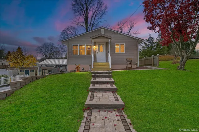 a front view of a house with a yard