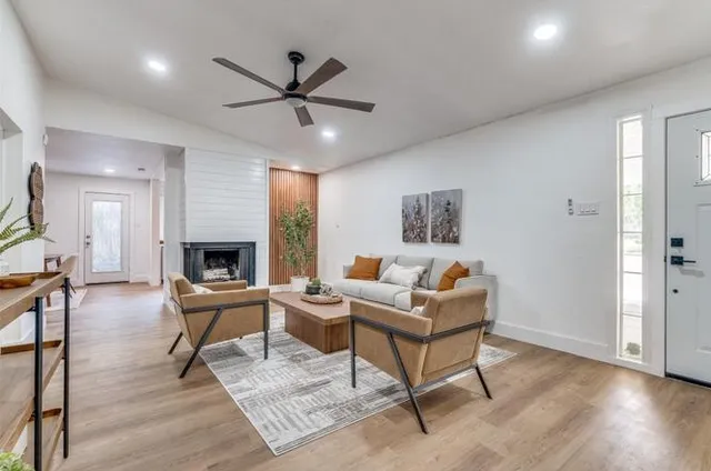 a living room with furniture and a fireplace