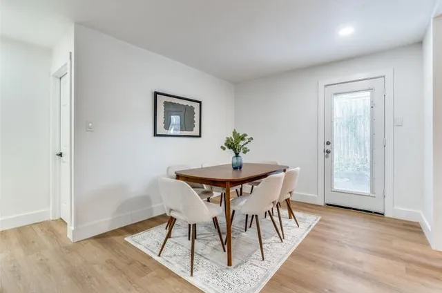 a view of a livingroom with furniture and wooden floor