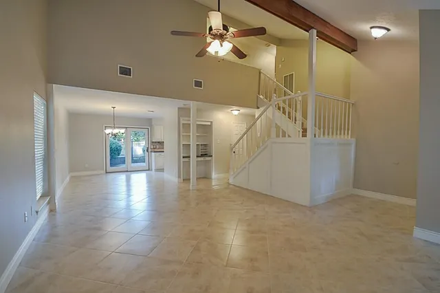 a view of a hall with an entryway