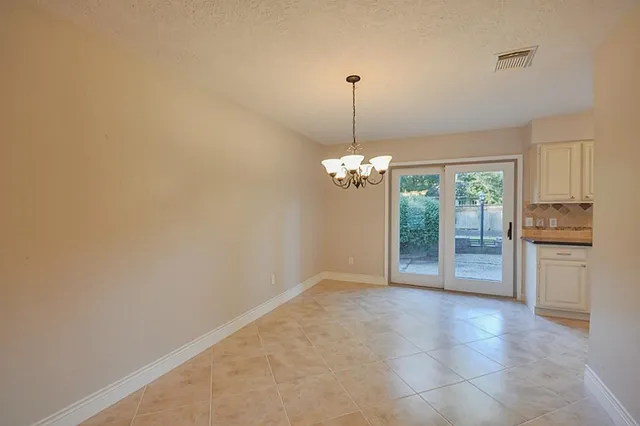 a view of a room with a chandelier