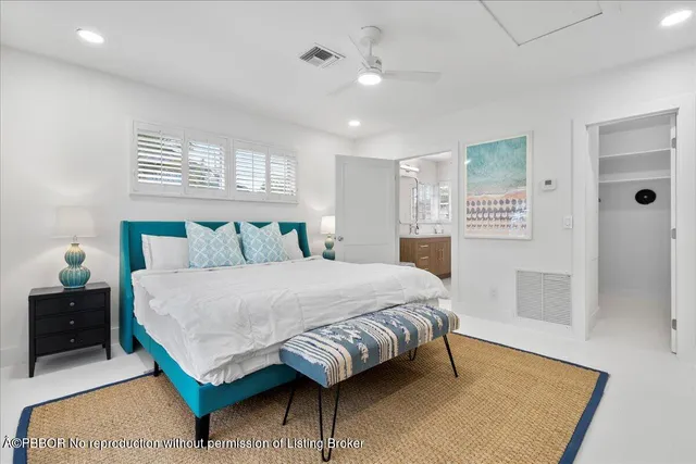 a bedroom with a bed and a table