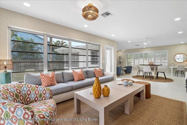 a living room with furniture and a table