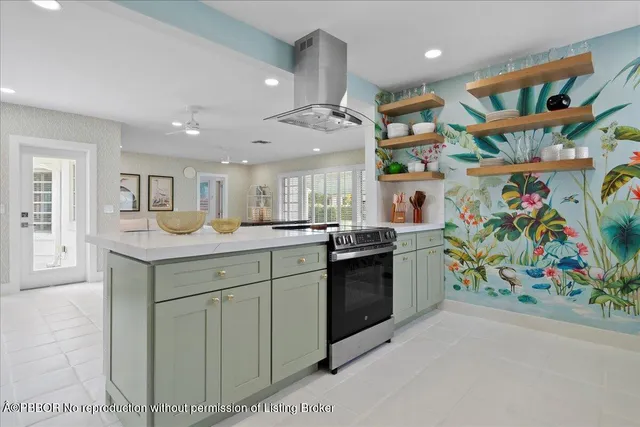 a kitchen with stainless steel appliances granite countertop a stove and cabinets