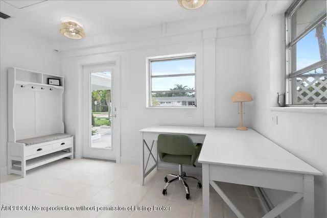 a workspace with furniture and a window