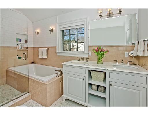 9 Stanley Road Darien, CT 06820 - Photo 11 of 20 a bathroom with a granite countertop sink a large mirror and a bathtub