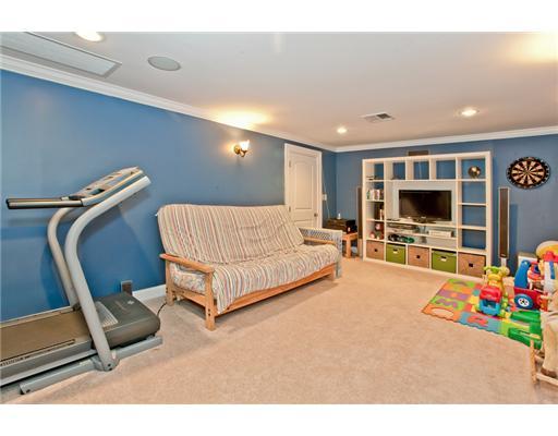 9 Stanley Road Darien, CT 06820 - Photo 16 of 20 a living room with a flat screen tv and a couch
