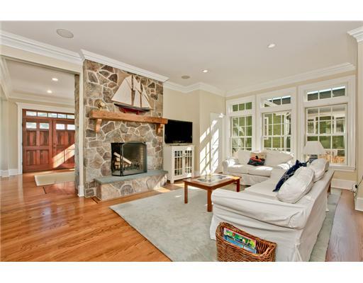 9 Stanley Road Darien, CT 06820 - Photo 3 of 20 a living room with furniture a fireplace and a flat screen tv