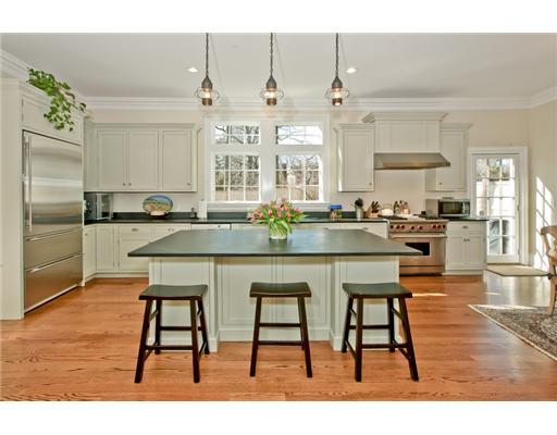 9 Stanley Road Darien, CT 06820 - Photo 5 of 20 a kitchen with stainless steel appliances kitchen island granite countertop a table chairs in it and wooden floors