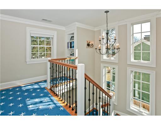 9 Stanley Road Darien, CT 06820 - Photo 9 of 20 a view of a porch with wooden floor and windows