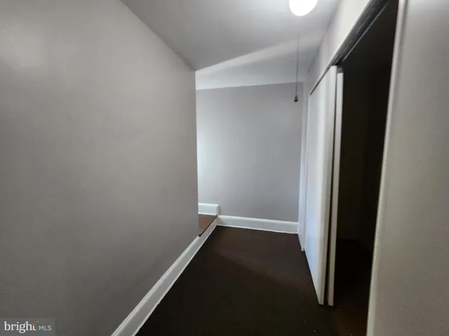 a view of hallway with closet