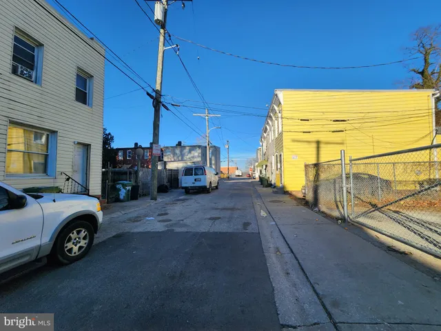 a view of a cars park in front of a house