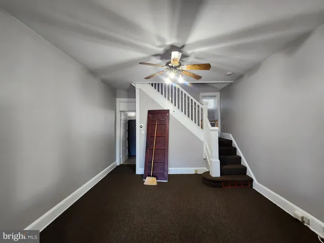 a view of entryway with stairs and wooden floor