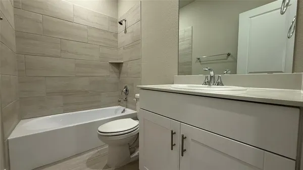 a bathroom with a sink a toilet and a bathtub