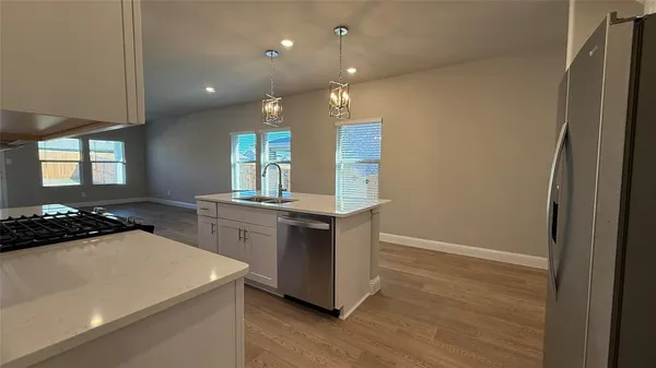 a kitchen with a sink and cabinets