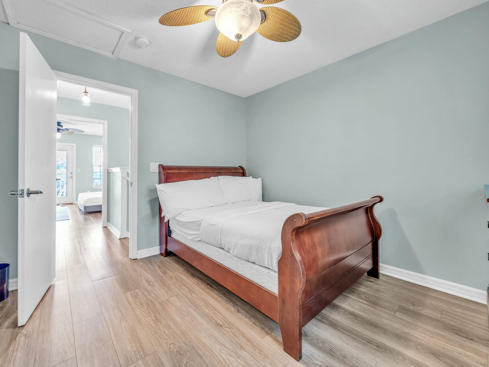 223 Redfish Circle Santa Rosa Beach, FL 32459 - Photo 12 of 26 a bedroom with a bed and wooden floor