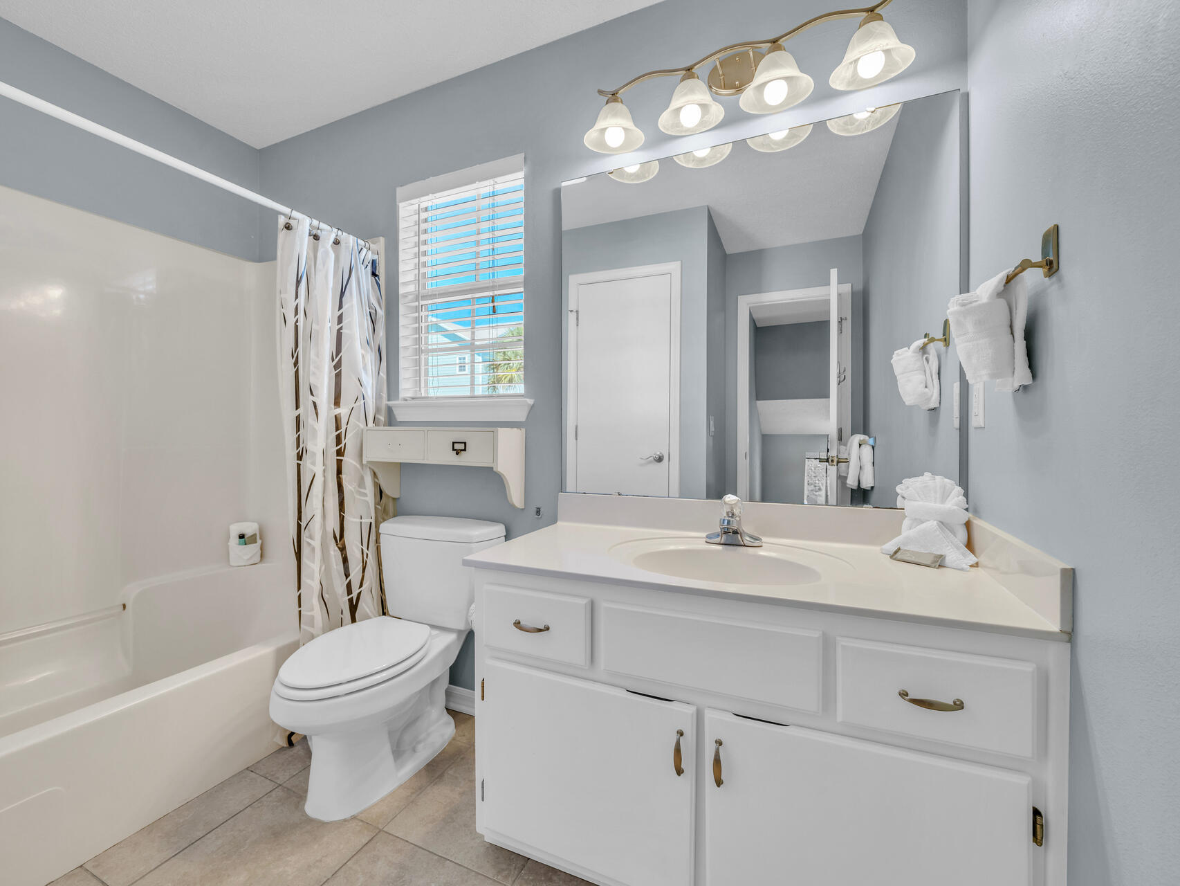 223 Redfish Circle Santa Rosa Beach, FL 32459 - Photo 13 of 26 a bathroom with a sink a toilet and a mirror