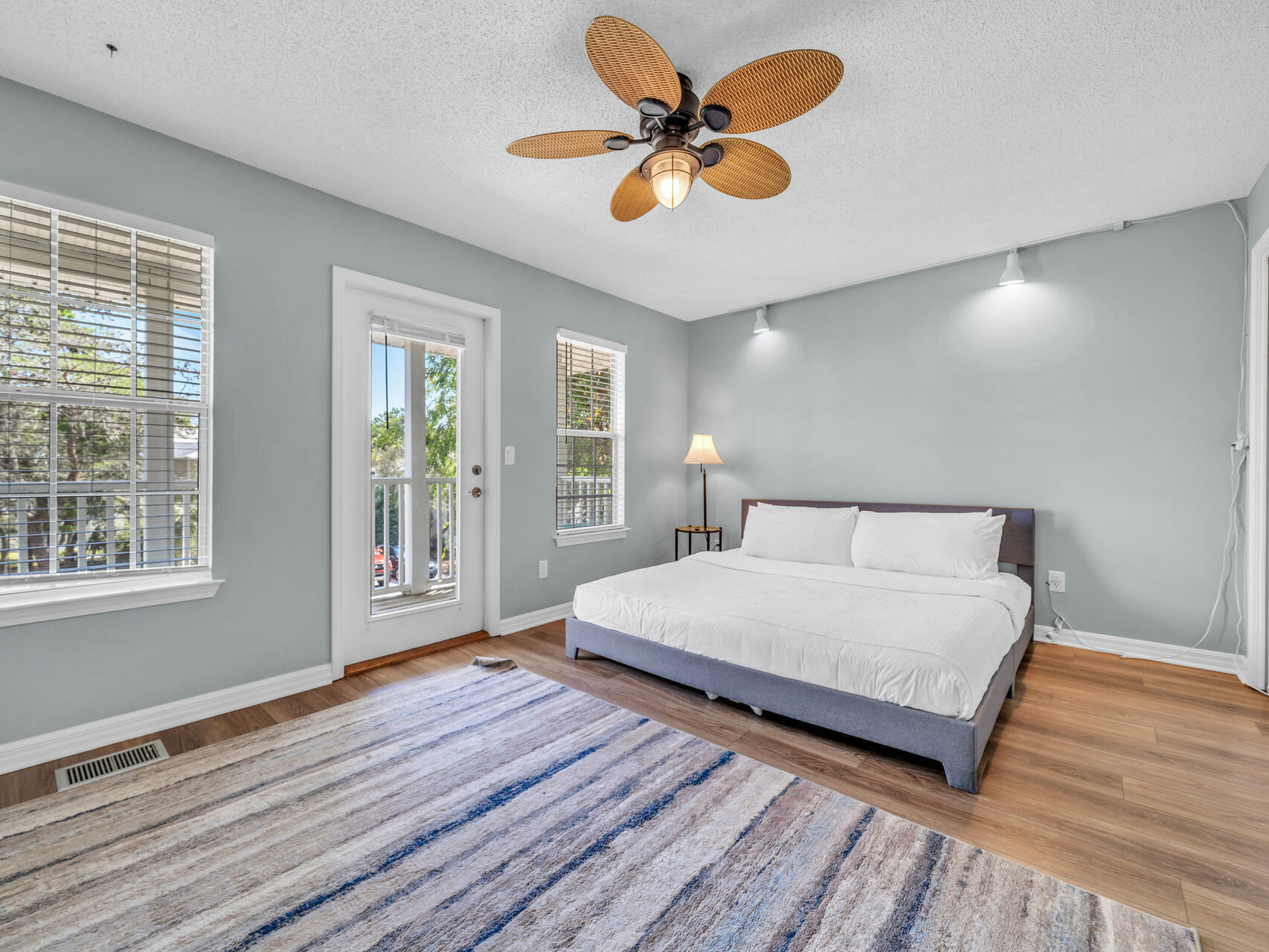 223 Redfish Circle Santa Rosa Beach, FL 32459 - Photo 14 of 26 a spacious bedroom with a bed and a chandelier