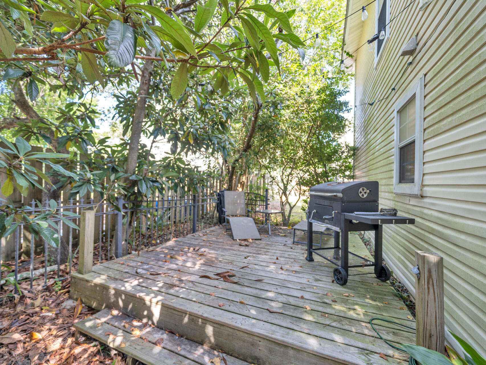 223 Redfish Circle Santa Rosa Beach, FL 32459 - Photo 19 of 26 a backyard of a house with table and chairs
