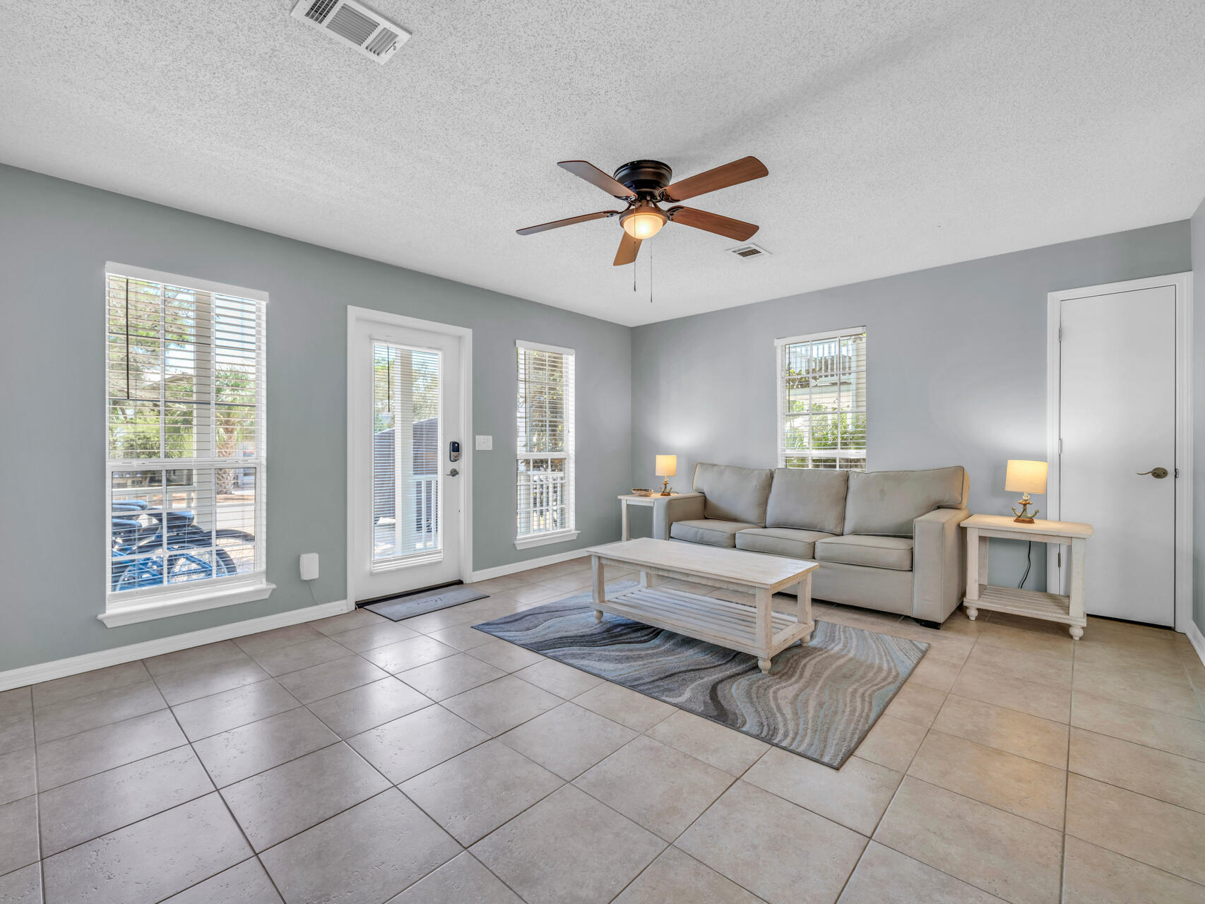 223 Redfish Circle Santa Rosa Beach, FL 32459 - Photo 2 of 26 a living room with furniture and a large window