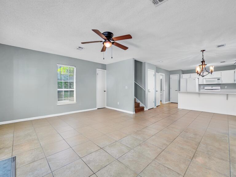 223 Redfish Circle Santa Rosa Beach, FL 32459 - Photo 6 of 26 a view of a kitchen with microwave and cabinets