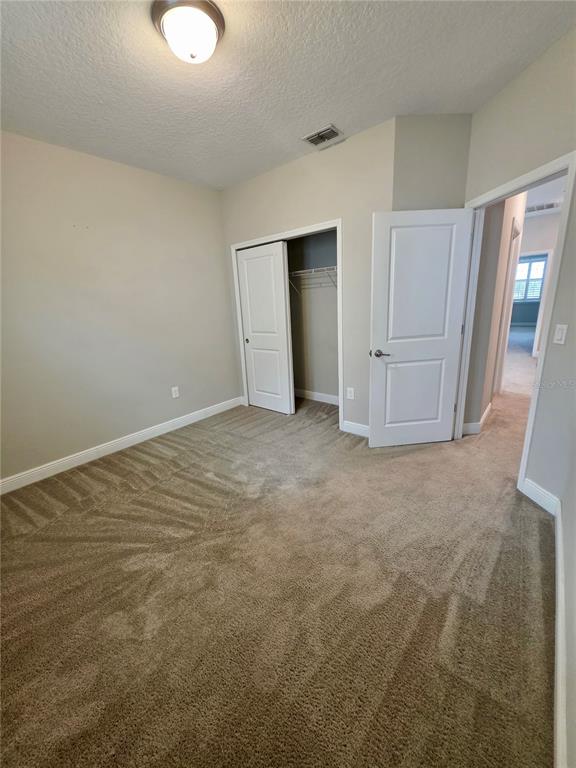 8582 Powder Ridge Trail Windermere, FL 34786 - Photo 18 of 50 an empty room with a fireplace