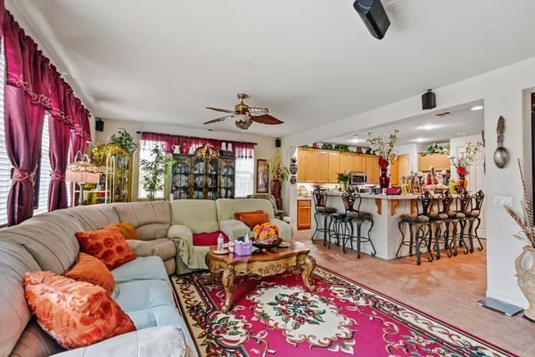 a living room with lots of furniture and rug