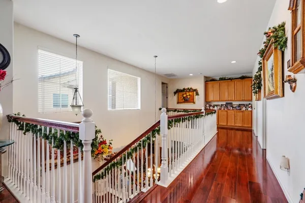 a view of a house with wooden floor and stairs