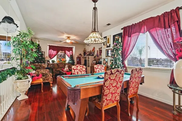 a view of a dining room with furniture and wooden floor