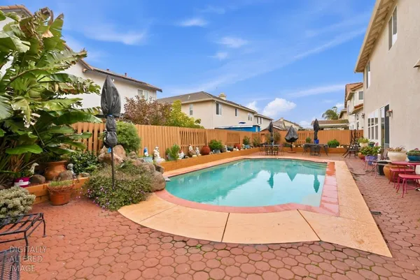 a view of a swimming pool with a patio
