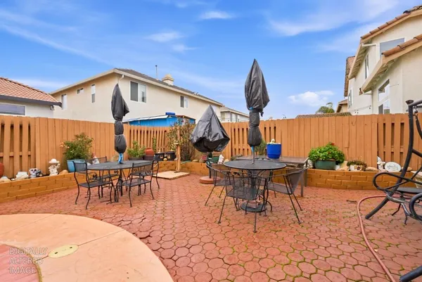 a view of a tables and chairs in patio