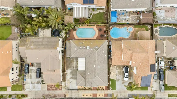an aerial view of a house with a yard