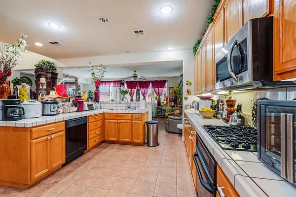 a kitchen with stainless steel appliances lots of counter top space