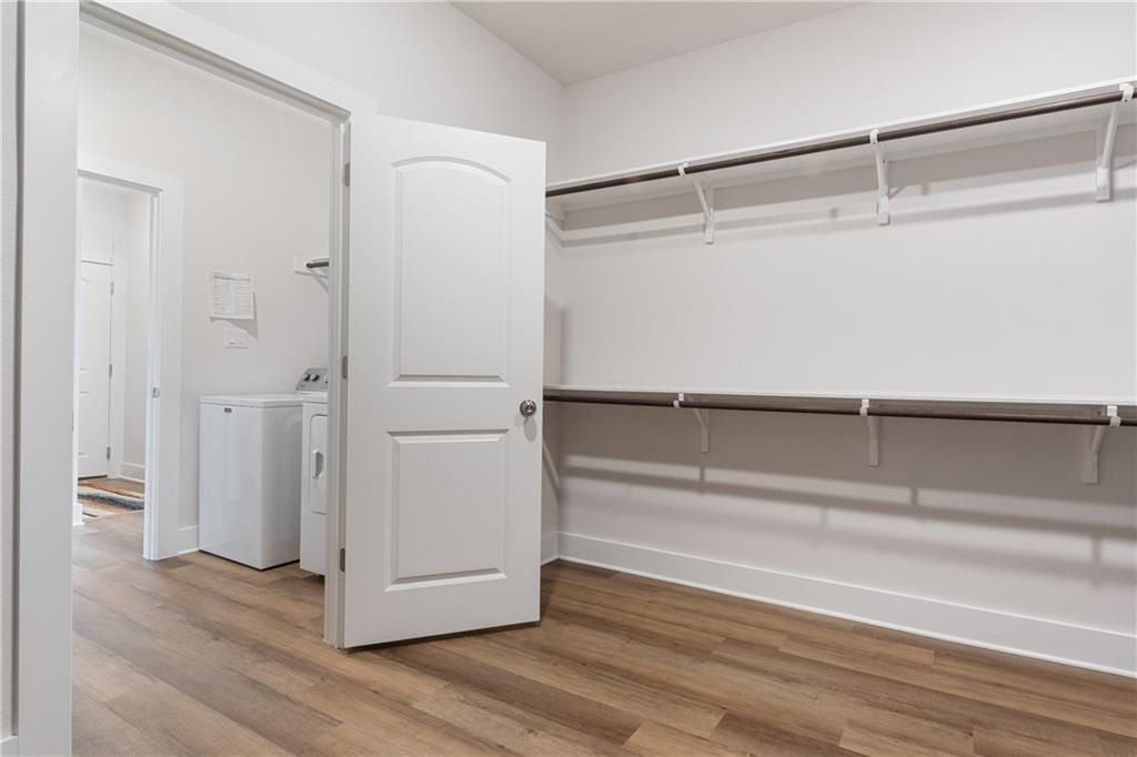 779 Founders Ridge Dripping Springs, TX 78620 - Photo 14 of 31 Primary closet opens to the laundry room - washer and dryer are not included.