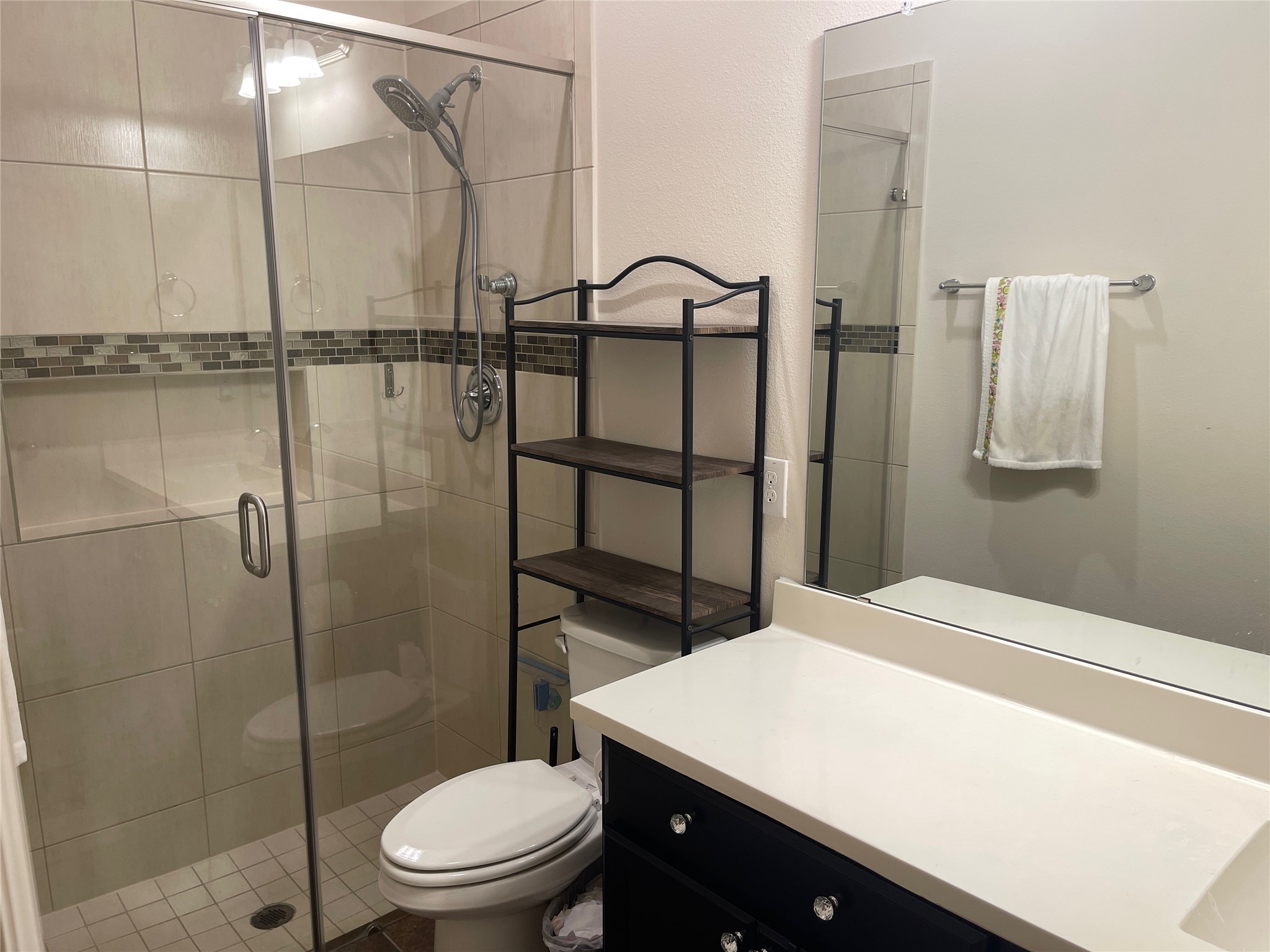 427 Stonebrook Lane Conroe, TX 77304 - Photo 13 of 15 a bathroom with a toilet a sink and shower