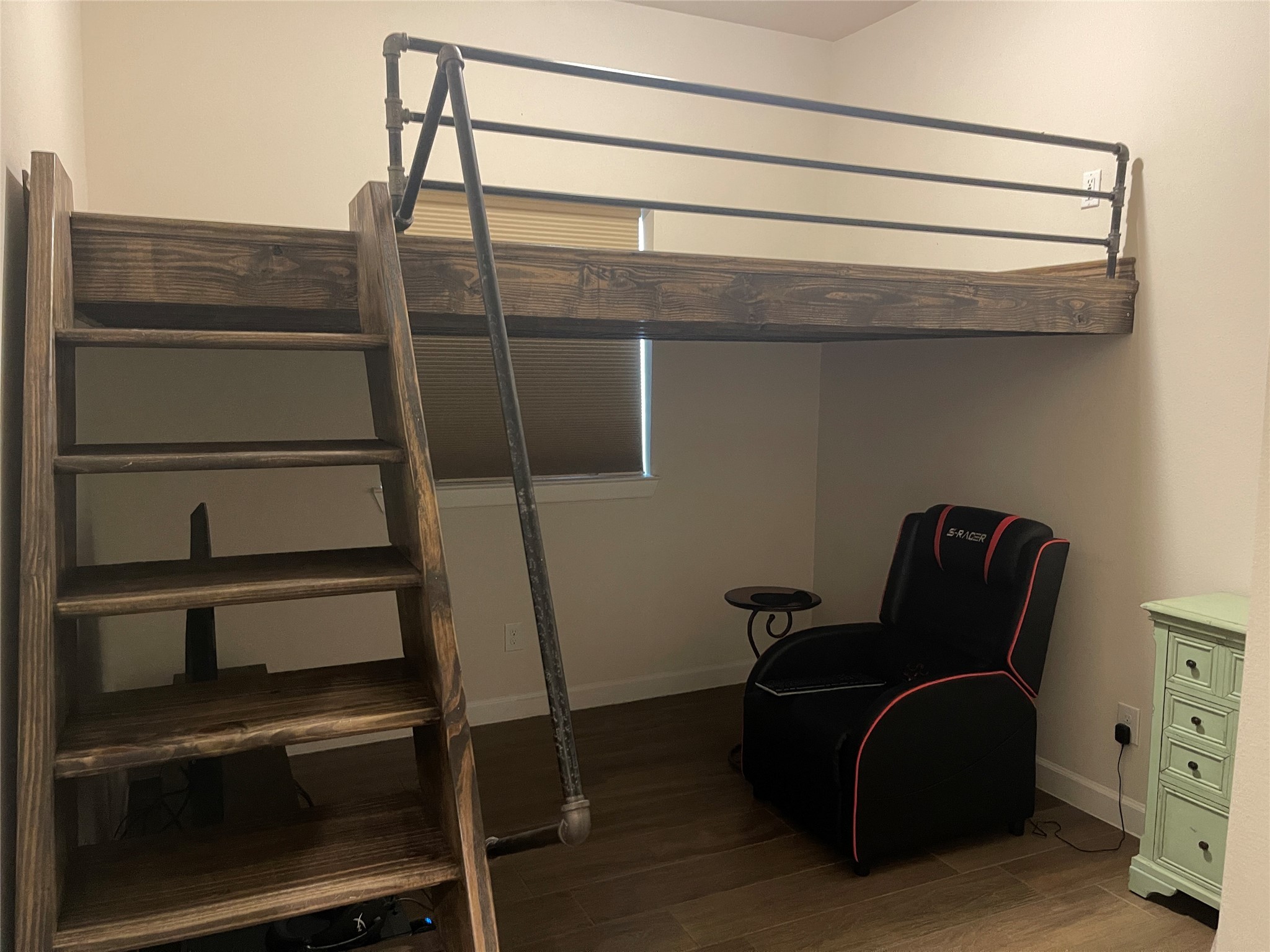 427 Stonebrook Lane Conroe, TX 77304 - Photo 14 of 15 a room with furniture and wooden floor