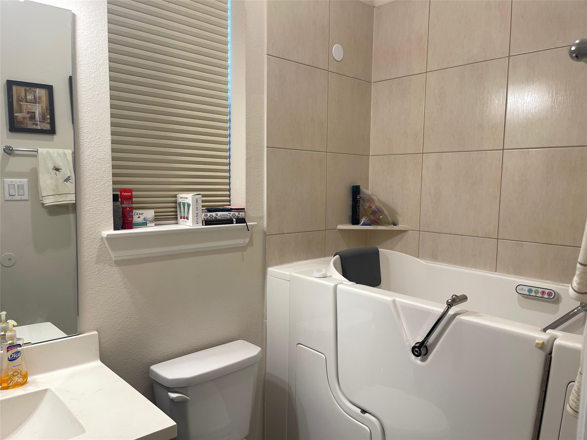 427 Stonebrook Lane Conroe, TX 77304 - Photo 15 of 15 a bathroom with a sink a toilet and a mirror