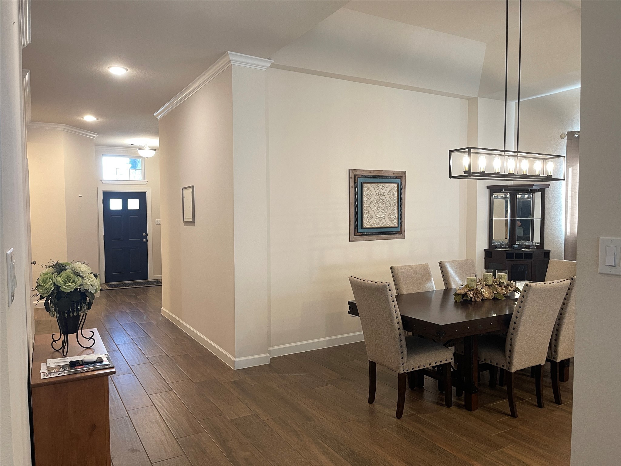 427 Stonebrook Lane Conroe, TX 77304 - Photo 3 of 15 a view of a dining room with furniture and wooden floor
